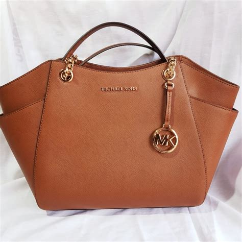 como identificar una cartera michael kors original|michael kors carteras para mujer.